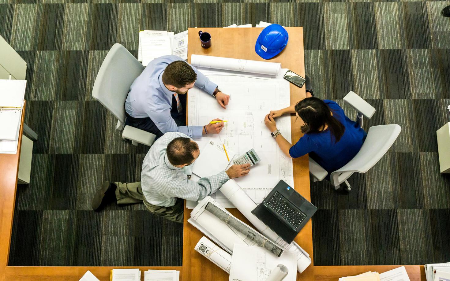 People working over a desk