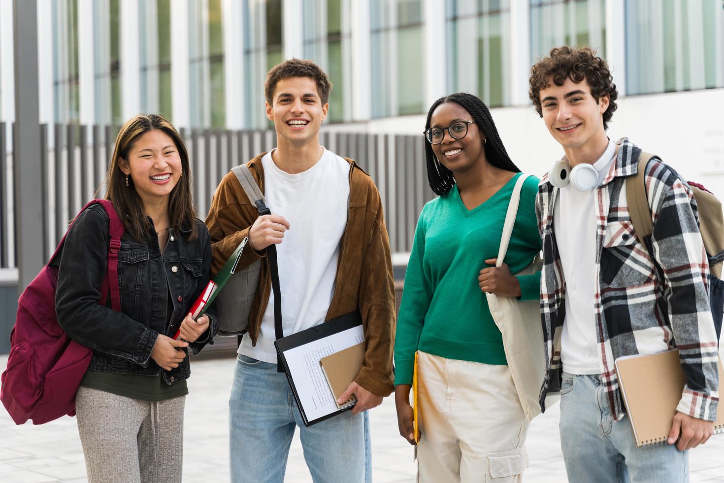Four students smiling at the camera