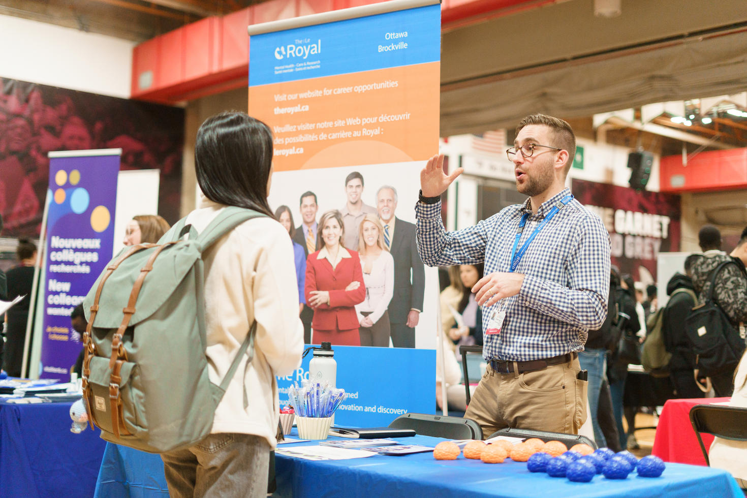 Student talking to a recruiter at a job fair