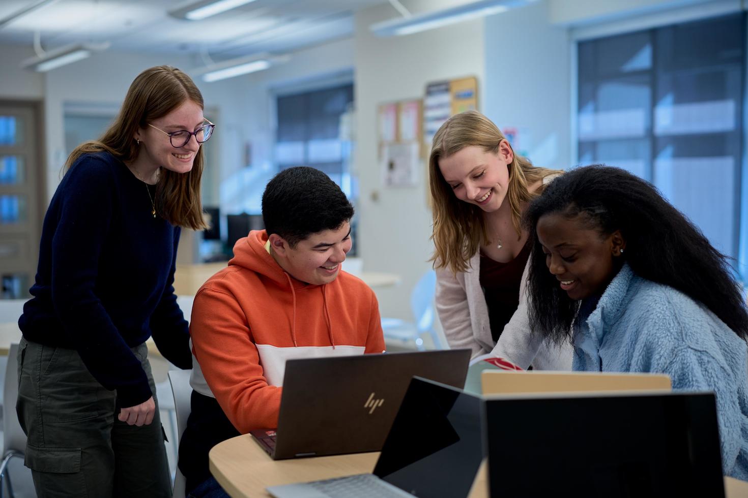 Four students in the resource centre