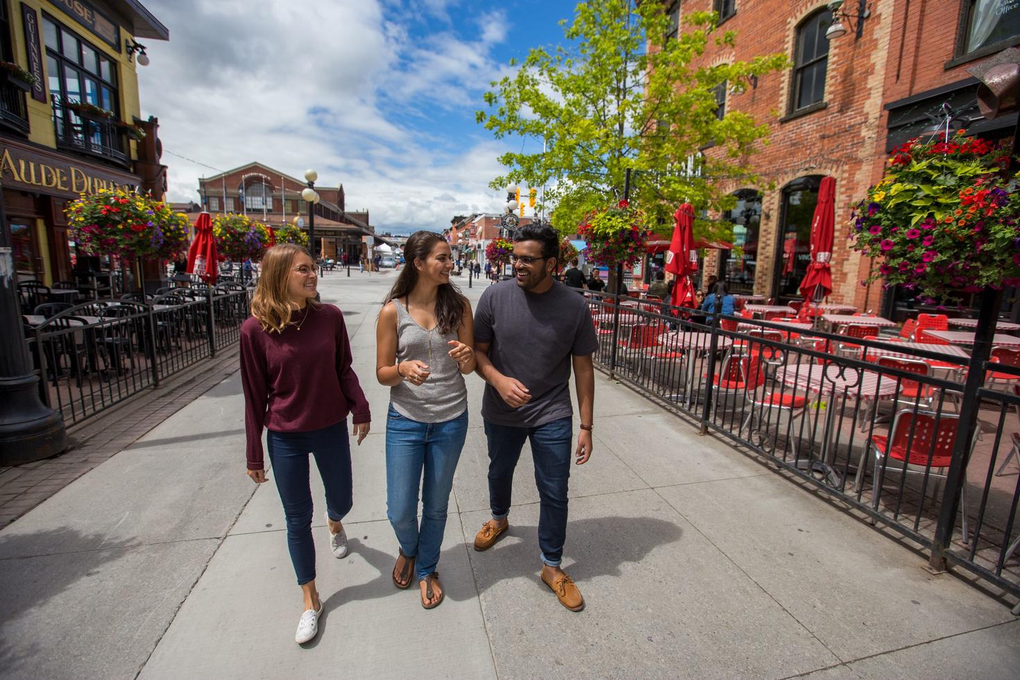 3 students walking in the Byward market