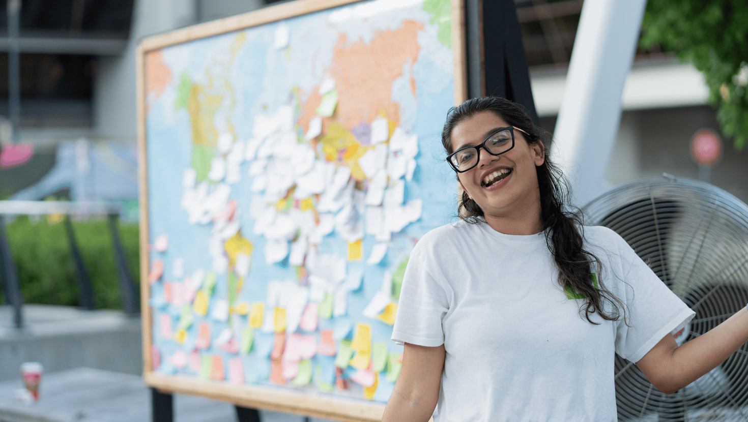 Girl standing before world map photo