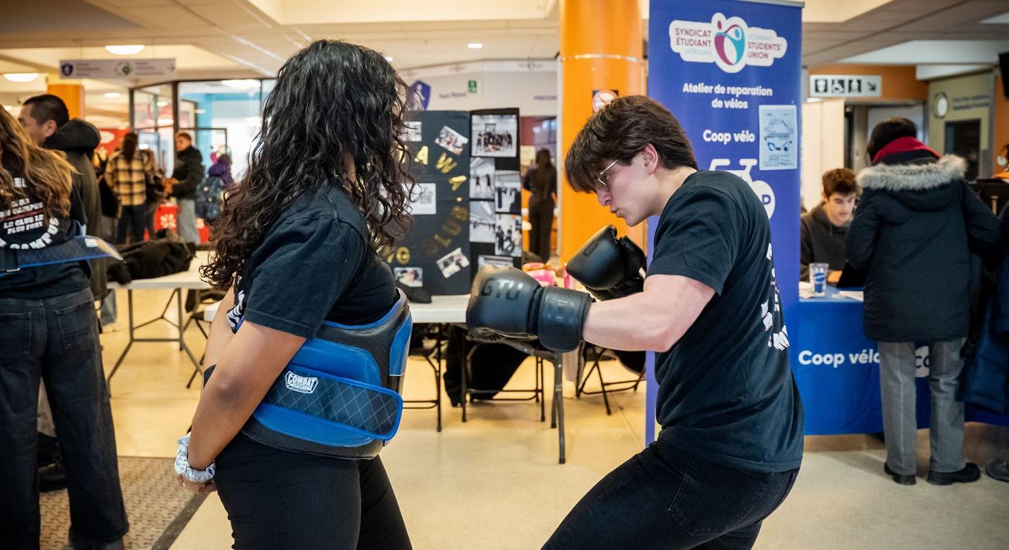 Members of the Boxing Club spar at the Winter Club Fair in 2026.
