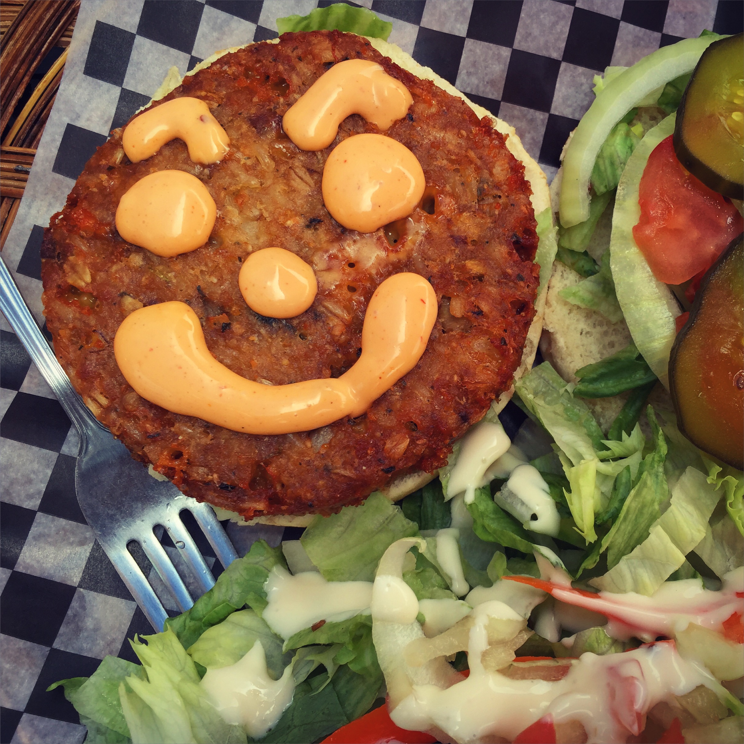 a veggie burger with a smiling face at uOttawa