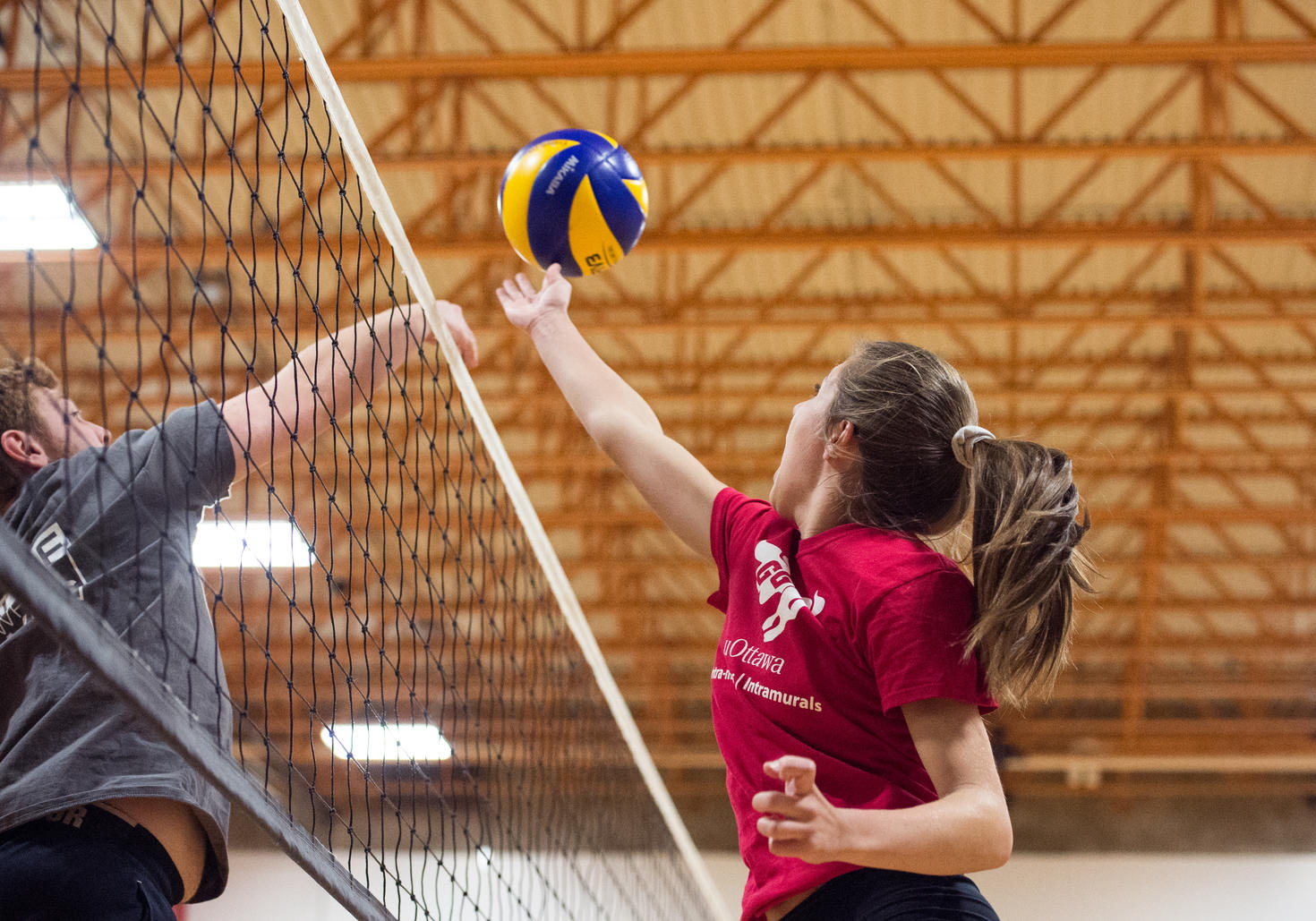Women playing volleyball.