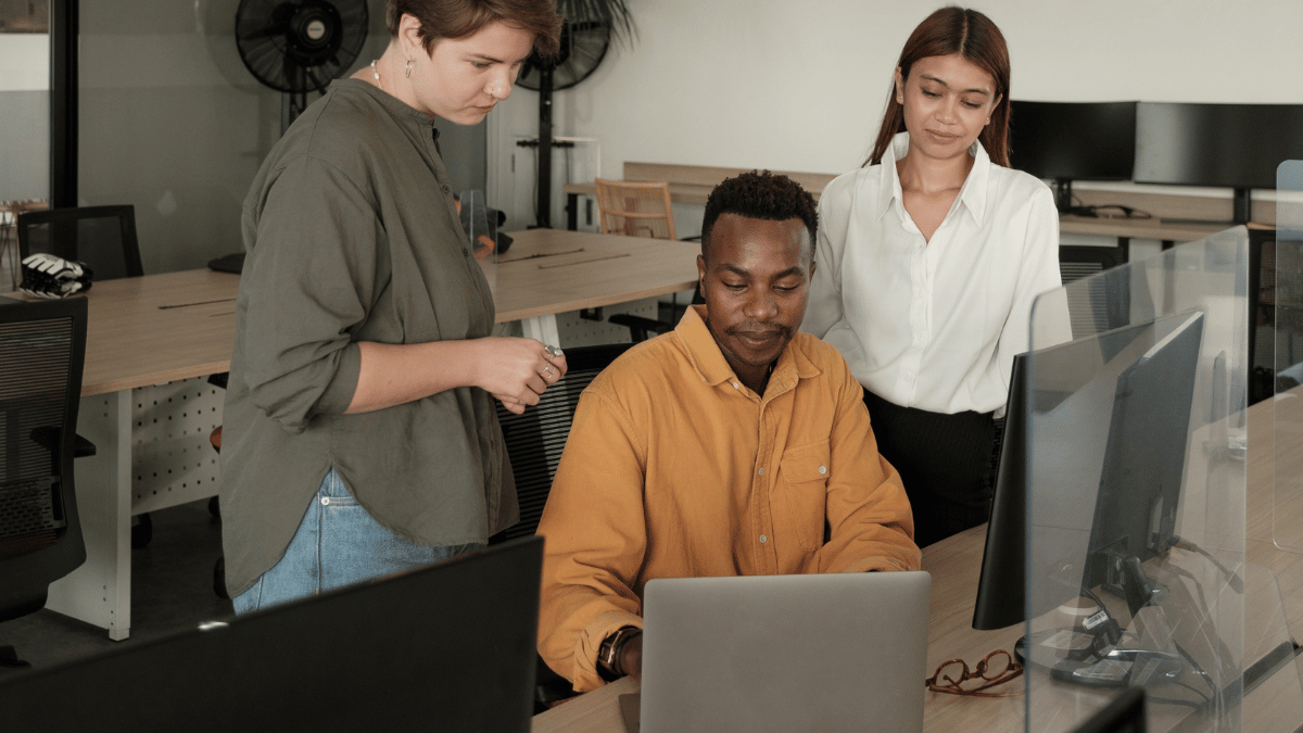 Startup employees reviewing screen.