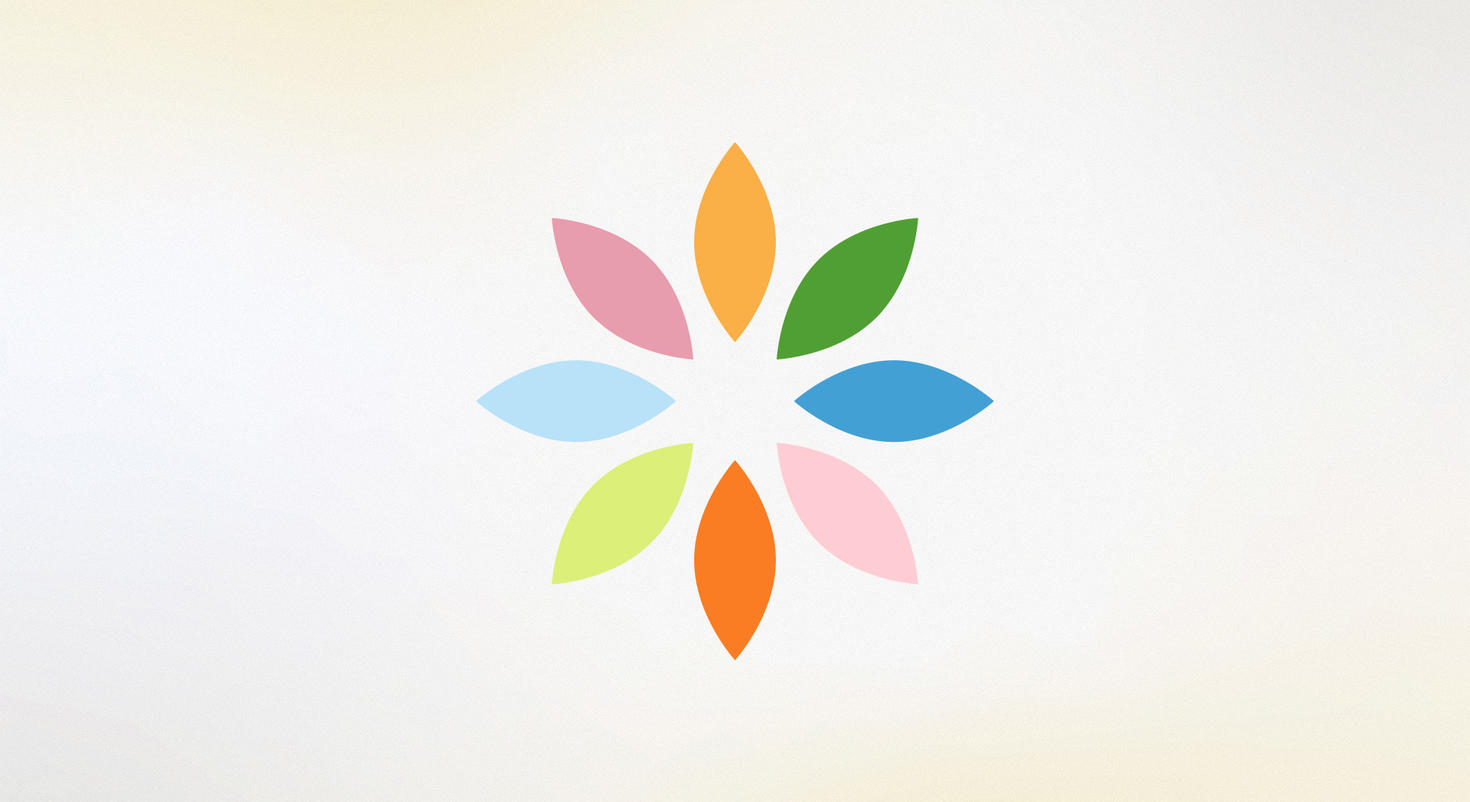 Le logo Wellness, composé de huit pétales, chacun d'une couleur pastel différente.