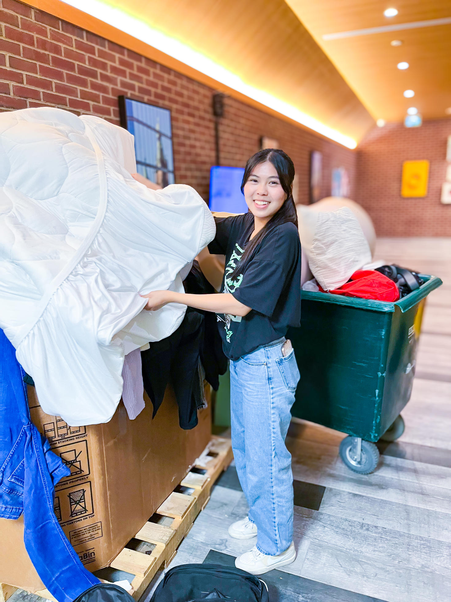 A student collects donations for the Free Store