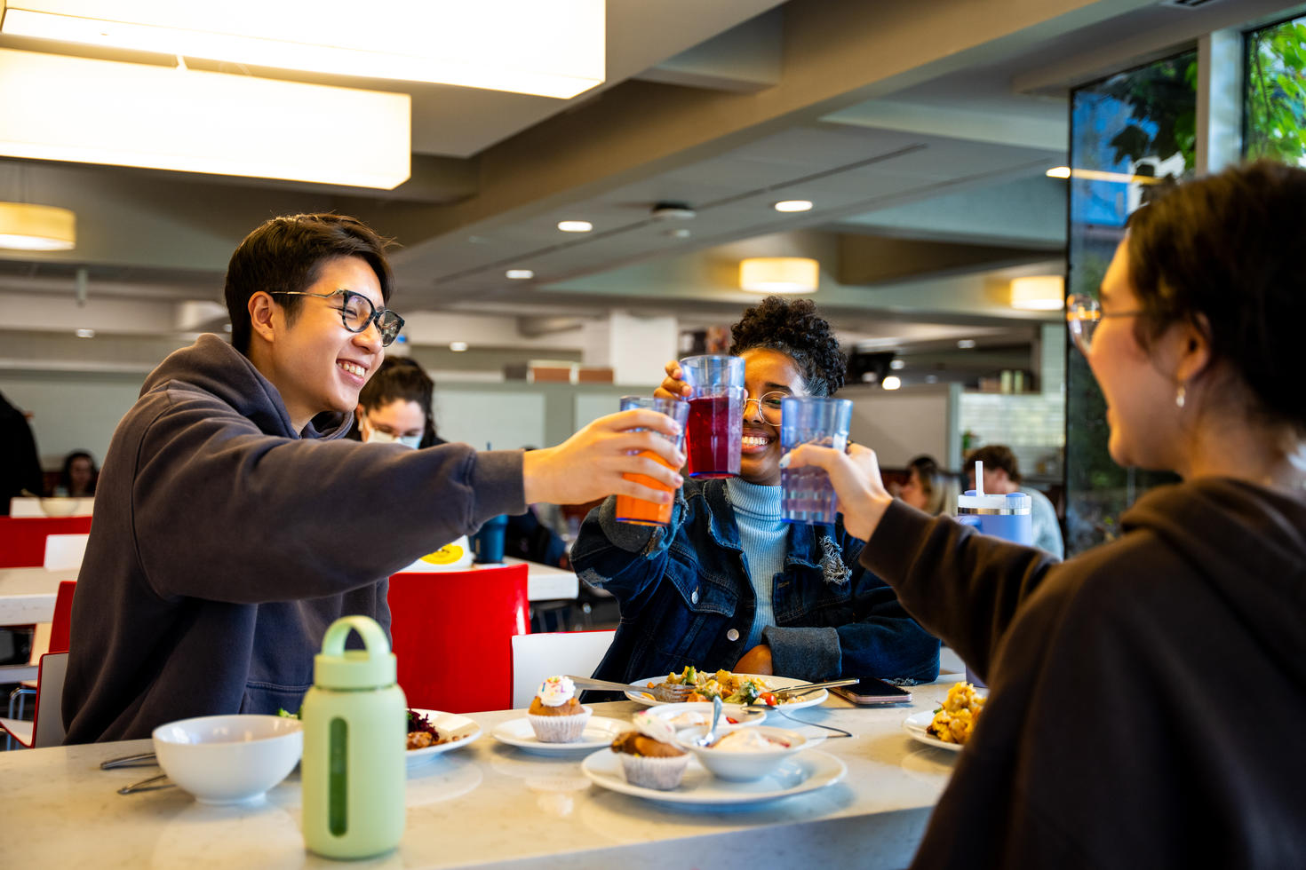 Friends sharing a meal in the dining hall